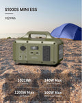 Portable power station S1000S MINI ESS on a beach with a tent in the background